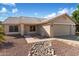 One-story house with a two-car garage and rock landscaping at 10869 W Alex Ave, Sun City, AZ 85373