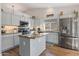 Updated kitchen featuring granite countertops and light gray cabinets at 10869 W Alex Ave, Sun City, AZ 85373