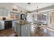 Modern kitchen with granite countertops and stainless steel appliances at 10869 W Alex Ave, Sun City, AZ 85373