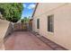 Backyard patio with wooden gate at 10869 W Alex Ave, Sun City, AZ 85373