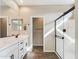 Bright bathroom boasts double sinks, a large shower, and modern vanity at 10993 W Pierce St, Avondale, AZ 85323