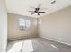 Well-lit bedroom featuring carpet and ceiling fan at 10993 W Pierce St, Avondale, AZ 85323