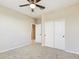 Bright bedroom with double door closet and carpet flooring at 10993 W Pierce St, Avondale, AZ 85323