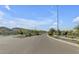 Landscaped road leading into a residential community at 10993 W Pierce St, Avondale, AZ 85323