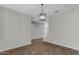 Bright dining area with wood-look floors and staircase view at 10993 W Pierce St, Avondale, AZ 85323