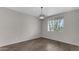 Dining room with wood-look tile floors and a modern light fixture at 10993 W Pierce St, Avondale, AZ 85323