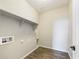 Convenient laundry room with built-in shelving at 10993 W Pierce St, Avondale, AZ 85323