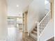 Modern staircase with white railings leading upstairs at 10993 W Pierce St, Avondale, AZ 85323