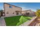 Two story home with backyard, grassy area and a trampoline at 11640 W Duran Ave, Youngtown, AZ 85363