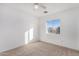 Bright bedroom with carpet flooring and a window offering an exterior view at 11640 W Duran Ave, Youngtown, AZ 85363