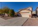 Two-story house with a large driveway and desert landscaping at 11640 W Duran Ave, Youngtown, AZ 85363