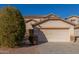 Two-story house with a large driveway and desert landscaping at 11640 W Duran Ave, Youngtown, AZ 85363