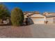 Two-story house with a large driveway and desert landscaping at 11640 W Duran Ave, Youngtown, AZ 85363