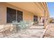 Covered patio with metal table and chairs at 1227 W Delmonte Dr, Casa Grande, AZ 85122