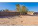 Empty lot with sand and a swing set in the backyard at 1227 W Delmonte Dr, Casa Grande, AZ 85122