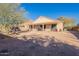 Single story home with a large backyard and covered patio at 1227 W Delmonte Dr, Casa Grande, AZ 85122