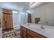 Double vanity bathroom with a bathtub and shower at 1227 W Delmonte Dr, Casa Grande, AZ 85122