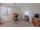 Bedroom with a desk, chair, and TV stand at 1227 W Delmonte Dr, Casa Grande, AZ 85122