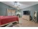 Primary bedroom with a dresser, TV, and ceiling fan at 1227 W Delmonte Dr, Casa Grande, AZ 85122