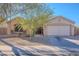 One-story house with attached garage and landscaping at 1227 W Delmonte Dr, Casa Grande, AZ 85122