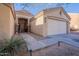 House with walkway leading to front door and two-car garage at 1227 W Delmonte Dr, Casa Grande, AZ 85122