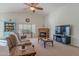 Spacious living room with fireplace and large TV at 1227 W Delmonte Dr, Casa Grande, AZ 85122