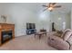 Living room with fireplace, TV and ample seating at 1227 W Delmonte Dr, Casa Grande, AZ 85122