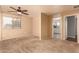 Bright bedroom with ceiling fan and carpeting at 12677 N 140Th Dr, Surprise, AZ 85379