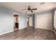 Bedroom with hardwood floors, ceiling fan and closet at 12677 N 140Th Dr, Surprise, AZ 85379