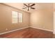 Bedroom with hardwood floors and ceiling fan at 12677 N 140Th Dr, Surprise, AZ 85379