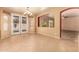 Dining room with French doors leading to patio and pool area at 12677 N 140Th Dr, Surprise, AZ 85379