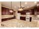 Eat-in kitchen with granite counters and ample cabinetry at 12677 N 140Th Dr, Surprise, AZ 85379