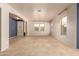 Bright living room featuring neutral walls and carpet, plus views to entry and backyard at 12677 N 140Th Dr, Surprise, AZ 85379