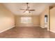 Living Room with wood-look flooring and ceiling fan at 12677 N 140Th Dr, Surprise, AZ 85379