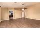 Spacious main bedroom with wood-look flooring and ceiling fan at 12677 N 140Th Dr, Surprise, AZ 85379