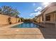 Refreshing pool with surrounding patio at 12677 N 140Th Dr, Surprise, AZ 85379