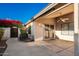 Backyard access with covered patio and wrought iron gate at 14033 W Two Guns Trl, Surprise, AZ 85374