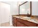 Bathroom with granite vanity and a large mirror at 14033 W Two Guns Trl, Surprise, AZ 85374