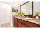 Bathroom featuring a granite countertop vanity and a large mirror at 14033 W Two Guns Trl, Surprise, AZ 85374