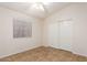 Bright bedroom with ceiling fan and double door closet at 14033 W Two Guns Trl, Surprise, AZ 85374