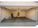 Spacious garage with open door and concrete flooring at 14033 W Two Guns Trl, Surprise, AZ 85374