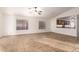 Living area with tile floors, neutral walls and a view of the kitchen at 14033 W Two Guns Trl, Surprise, AZ 85374