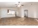 Living room with tile floors, high ceilings, and an open floor plan at 14033 W Two Guns Trl, Surprise, AZ 85374