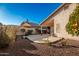 Spacious backyard patio with a covered area and ceiling fan at 14033 W Two Guns Trl, Surprise, AZ 85374