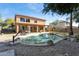 Backyard oasis featuring a pool, patio, and basketball hoop at 1440 S Central Dr, Chandler, AZ 85286