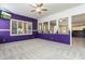 Large bedroom with purple walls, window seat, and views of kitchen at 1440 S Central Dr, Chandler, AZ 85286