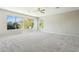 Spacious bedroom featuring a ceiling fan and large windows at 1440 S Central Dr, Chandler, AZ 85286