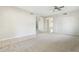 Open living room with neutral carpet, tile, and access to the kitchen area at 1440 S Central Dr, Chandler, AZ 85286