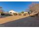 Large backyard with a basketball hoop and desert landscaping at 14529 N 87Th Dr, Peoria, AZ 85381