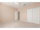 Bright bedroom with carpet flooring and double door closet at 14529 N 87Th Dr, Peoria, AZ 85381